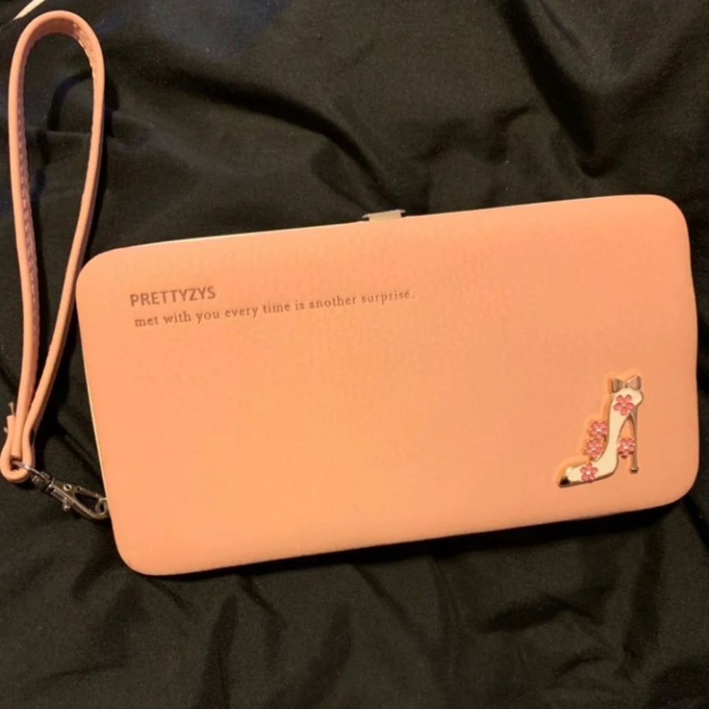 Pink wallet with strap